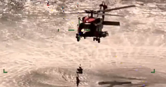 Coast Guard rescues boaters found ‘fending off sharks’